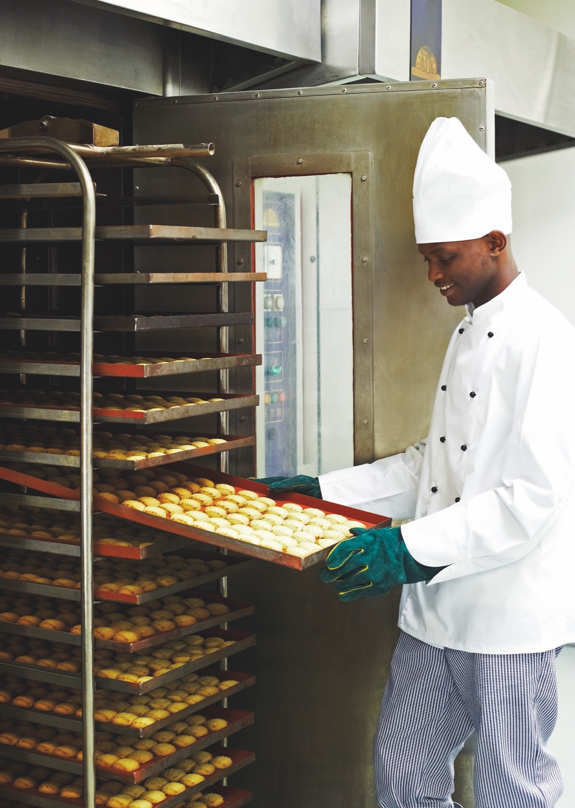 A master baker at The Cookie Factory working beside the oven racks